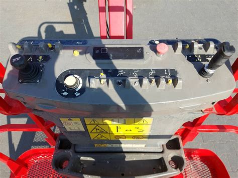 Panel sterowania ładowarki Bobcat S160 z widocznymi kontrolkami
