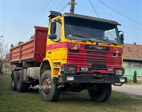 Zdjęcie przedstawiające klasyczną ciężarówkę Scania serii 113 w konfiguracji wywrotka