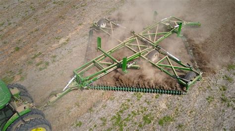Thematic photo of a field harrow in action on a farm