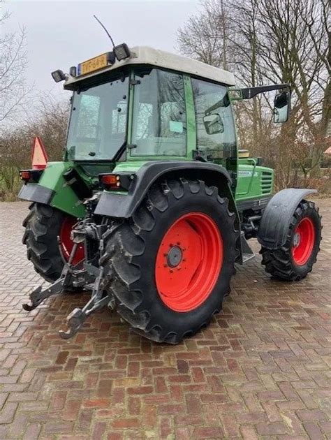 The Fendt Farmer 308 tractor in action on a farm field, with a focus on its robust construction and ergonomic cabin.
