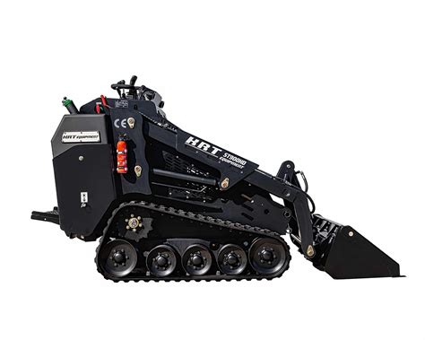 Thematic photo of a compact stand-on tracked mini loader at work.