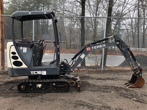 The Terex TC16 mini excavator in operation, showcasing its compact design and functionality.