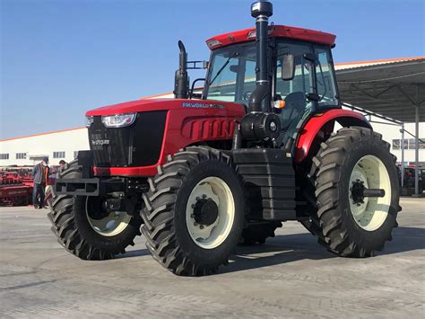 Thematic photo of a modern front loader on a tractor in an agricultural setting