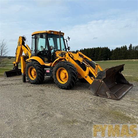 Thematic photo of a JCB 4CX excavator-loader working