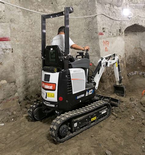 Thematic photo of a Bobcat mini-excavator working on a construction site