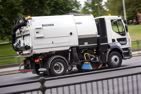 Thematic photo of a Bucher municipal vehicle working in an urban environment