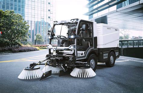Thematic photo of a Bucher municipal sweeper working on a city street