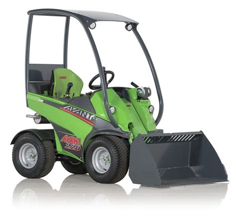 The Avant 220 compact loader with a separating rotary tiller attachment working on a field, showing its compact size and efficiency.