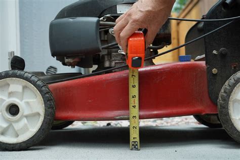 Diagram showing ergonomic handle design and easy height adjustment of a lawn mower
