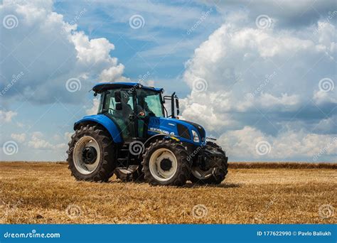 Thematic photo of a New Holland agricultural tractor working in a field