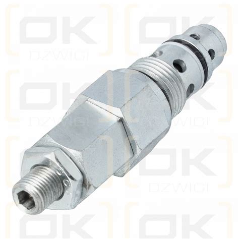 Zdjęcie rozdzielacza hydraulicznego z zaznaczonymi miejscami cewek w koparce CAT 428D/F