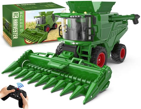 Thematic photo of a toy combine harvester in action, possibly with a child playing
