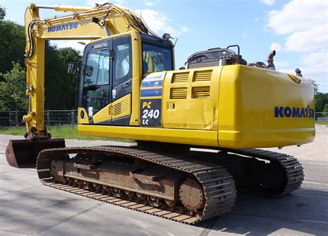 Komatsu PC240 excavator working on a construction site
