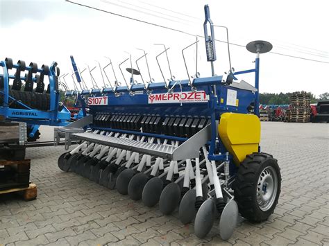 Thematic photo of Meprozet S107 sower on a field with a small tractor