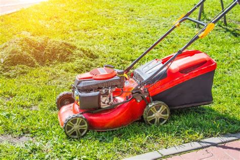 Thematic photo of a lawn mower working on a lawn