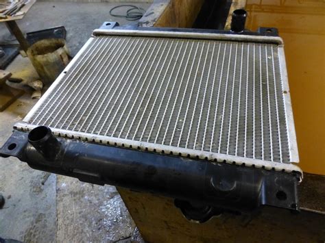 Photo of a tractor radiator being cleaned