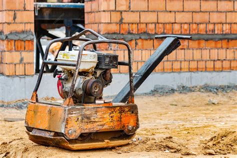 Thematic photo of a large plate compactor working on a construction site