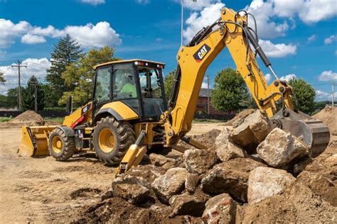 Thematic photo of a Cat backhoe loader in action on a construction site
