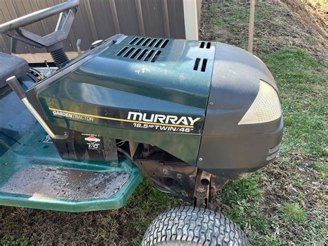 Thematic photo of a Murray lawn tractor working in a garden