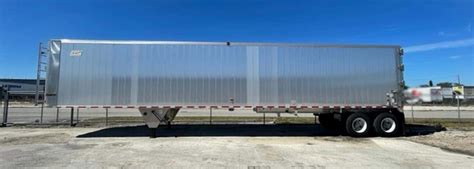 Thematic photo of a semi-trailer truck with a walking floor trailer on a road