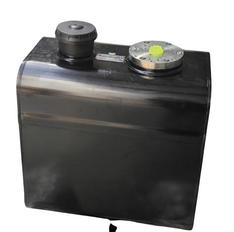 Zbiornik oleju hydraulicznego i filtry w koparko-ładowarce JCB