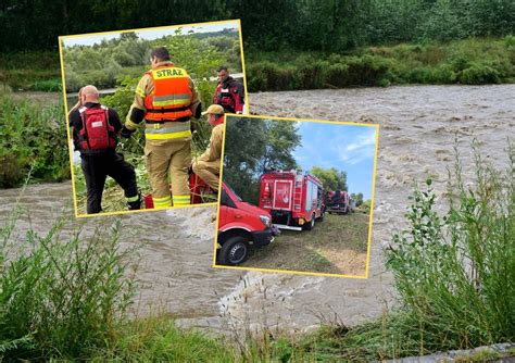 Dźwig wyciągający ciągnik z rzeki Dunajec po wypadku
