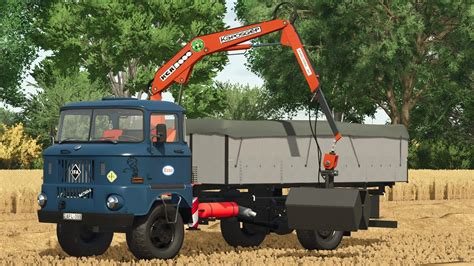 Zdjęcie IFA W50 LA/Z z podpiętą maszyną rolniczą