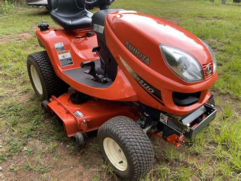Thematic photo of a Kubota tractor mower working on a lawn