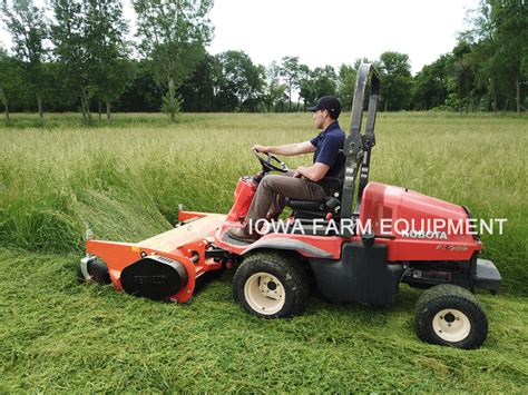 Photo of a Kubota mini-tractor with a flail mower attachment