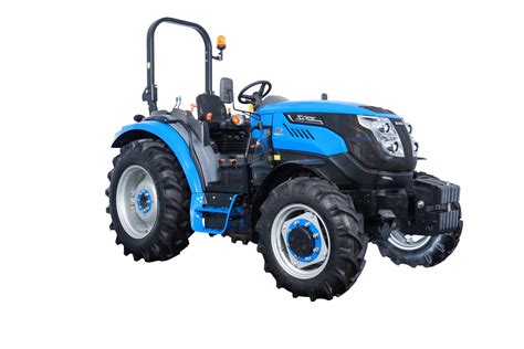 The Solis S60 compact tractor operating in a vegetable field, highlighting its maneuverability and size.