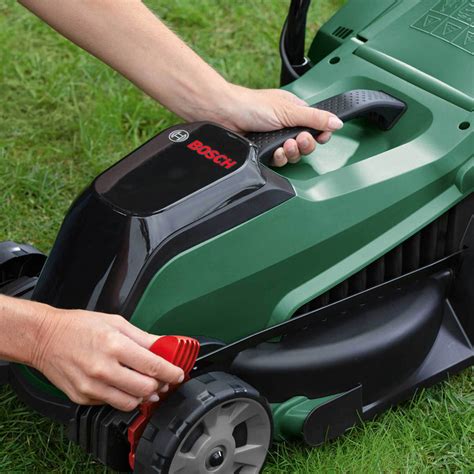 The NAC LE18-40-PB-S electric lawnmower with central height adjustment, showing its compact design and large grass catcher.
