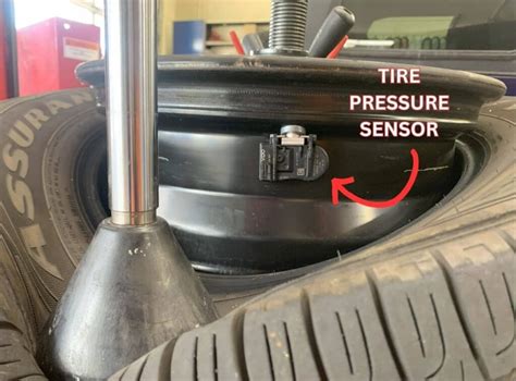 Photo of a TPMS sensor installed on a heavy machinery tire