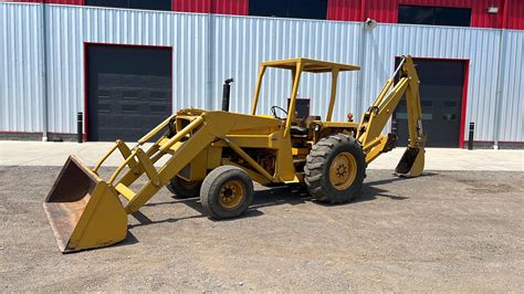 Thematic photo of a Massey Ferguson backhoe loader working on a construction site