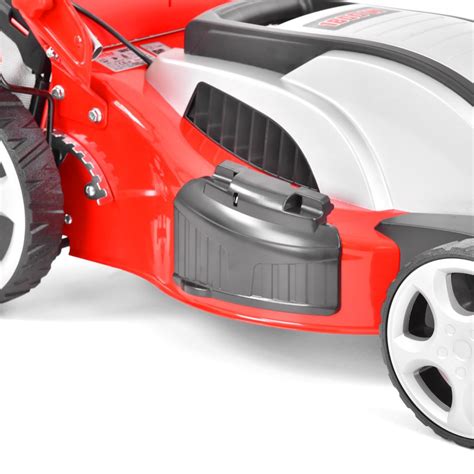 Thematic photo of the HECHT 1803 S electric lawnmower in use in a garden