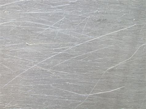 Detail photo of poorly painted and scratched metal parts