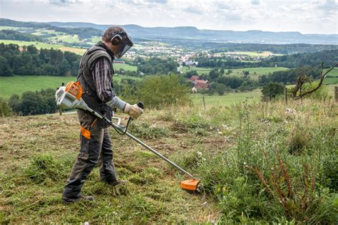 Thematic photo of a Stihl petrol brushcutter in use in a garden