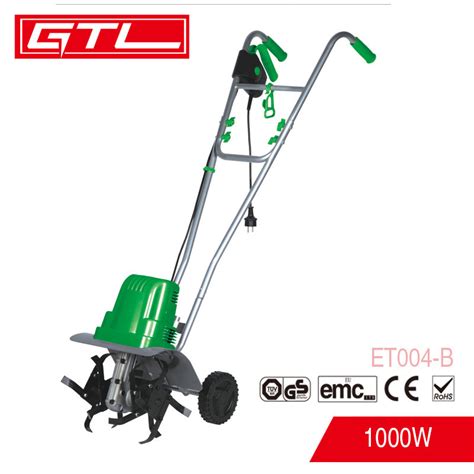 The MacAllister 1400W electric tiller in a garden setting, preparing soil