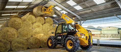 The 542-70 Agri Pro telescopic loader in action, showing its boom extended, with an emphasis on the cabin and controls. (Panoramic photo, modern machinery)