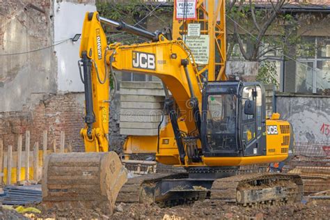 Thematic photo of a JCB excavator at a construction site