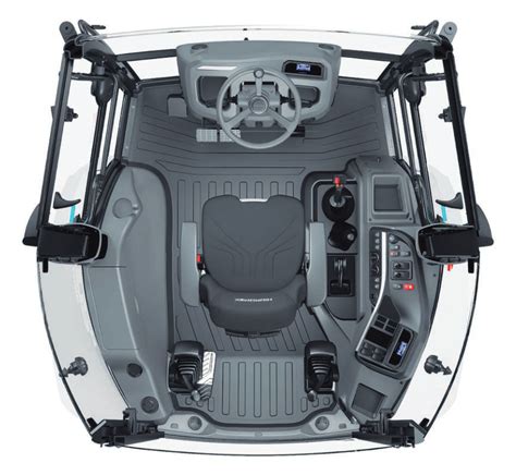 Wnętrze kabiny ładowarki kołowej z ergonomicznym rozmieszczeniem elementów sterowania