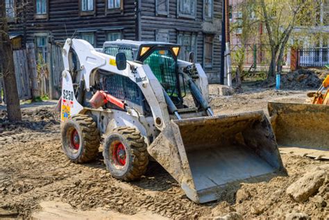 Thematic photo of a Bobcat loader working on a construction site