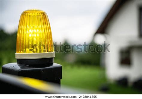 Photo of a tractor with a yellow flashing light (