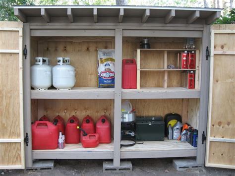 Photo of properly stored fuel canisters in a garage or shed.