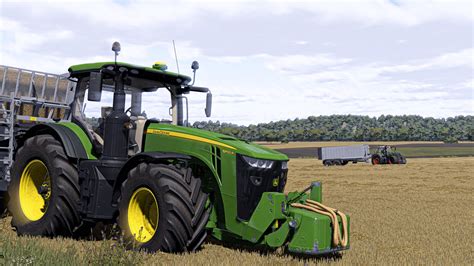 Zdjęcie autonomicznego ciągnika John Deere 8R podczas pracy na polu.