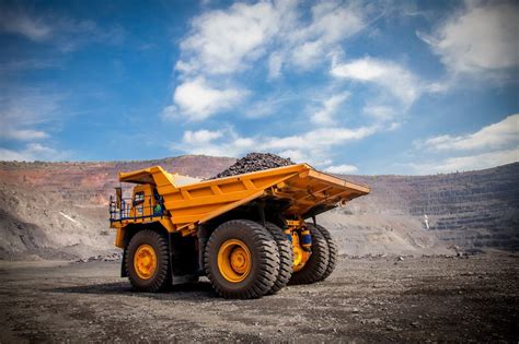 Thematic photo of a compact dump truck at work on a construction site