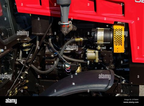 Close-up of a Belarus tractor's engine, highlighting its robust, simple construction and mechanical components.