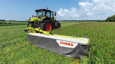 Claas DISCO CONTOUR rear mower attached to a tractor