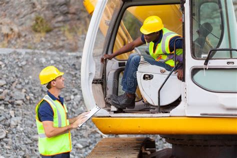 Photo of a professional excavator operator on a construction site
