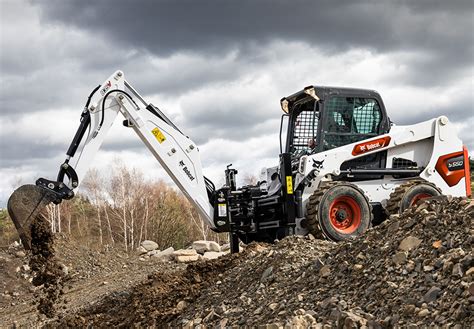 Thematic photo of a Bobcat mini excavator with an attachment in action