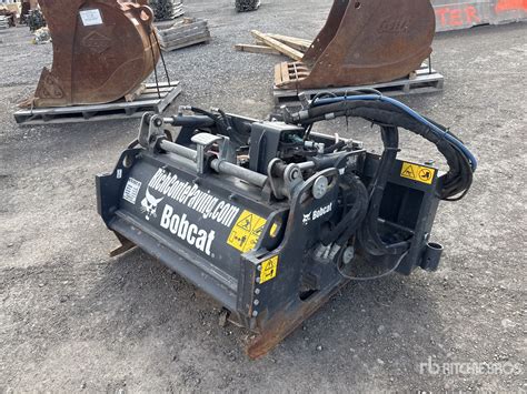 Infographics of a Bobcat mini excavator with a cold planer attachment